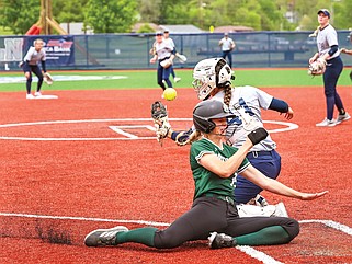 Northwest Missouri’s Annie Gahan slides in home safely behind Lincoln catcher Jamilyn Bagby as the ball gets past her glove in the fourth inning of the first game of Friday’s doubleheader at LU Softball Field. (Julie Smith/News Tribune)